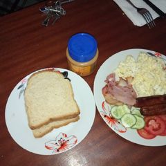 A picture of Scrambled eggs, bacon and sausages #breakfastcontest.