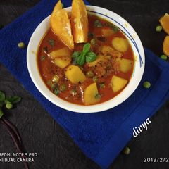 A picture of Orange aloo curry.