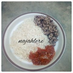 A picture of White rice, stew and beans.