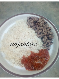 A picture of White rice, stew and beans.