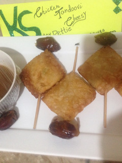 A picture of Chicken tandori cheesy Pettie with imli and khajoor chutney.