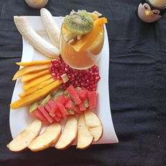 A picture of Fresh Fruits and Mango juice.