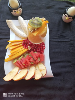 A picture of Fresh Fruits and Mango juice.
