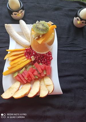 A picture of Fresh Fruits and Mango juice.