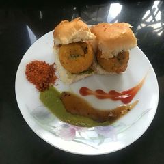 A picture of Spicy cheese masala vada pav.