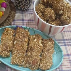 A picture of Dryfruits and til Patti or ladoo.