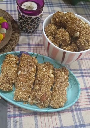 A picture of Dryfruits and til Patti or ladoo.