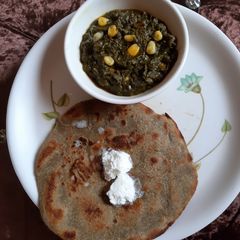 A picture of Bajre ki roti Sarso ke saag ke sath.