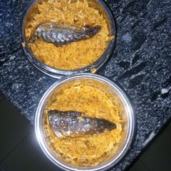 A picture of Jollof rice with fish.