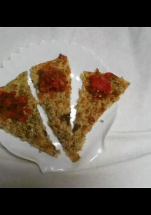 A picture of 1.Cauliflower “pizza” with homemade grilled pepper cream “ajvar”.