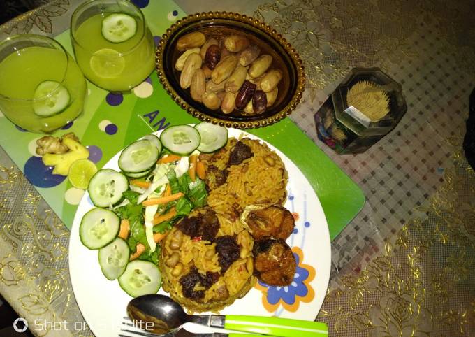 Jollof rice and beans with ginger and cucumber drink