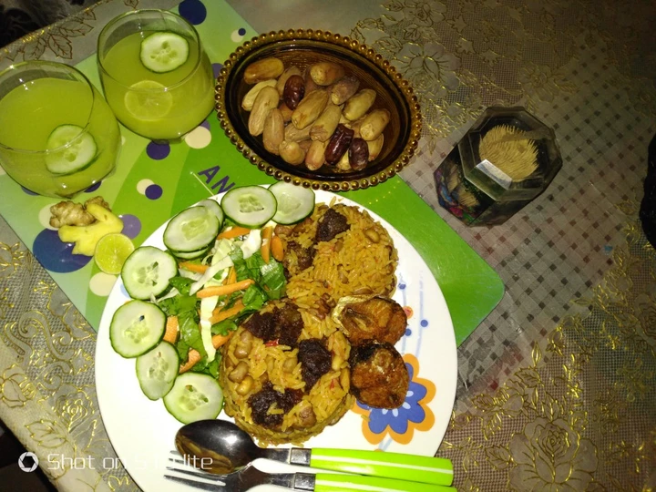 Simple Way Make Recipe Jollof rice and beans with ginger and cucumber drink that is Delicious, Appealing}