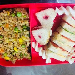 A picture of Vegetable daliya and jam /veg mayo sandwich.