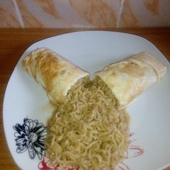 A picture of Noodles and Fried eggs.