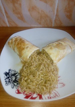 A picture of Noodles and Fried eggs.