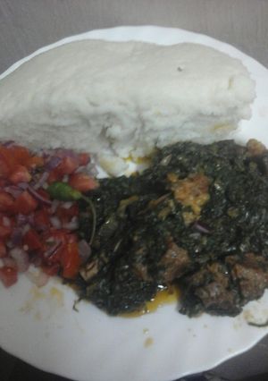 A picture of Ugali and sukumawiki,spinach with meat #localfoodcontest_mombasa.