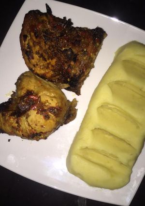 A picture of Mashed potatoes & grilled chicken.
