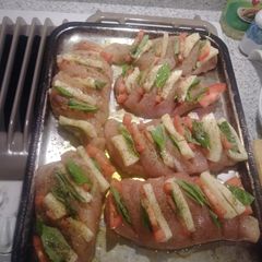 A picture of Stuffed chicken witb basil mozzarella and tomato.