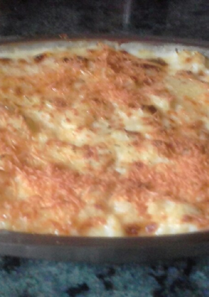 Una foto de Coliflor con bechamel y cebolla