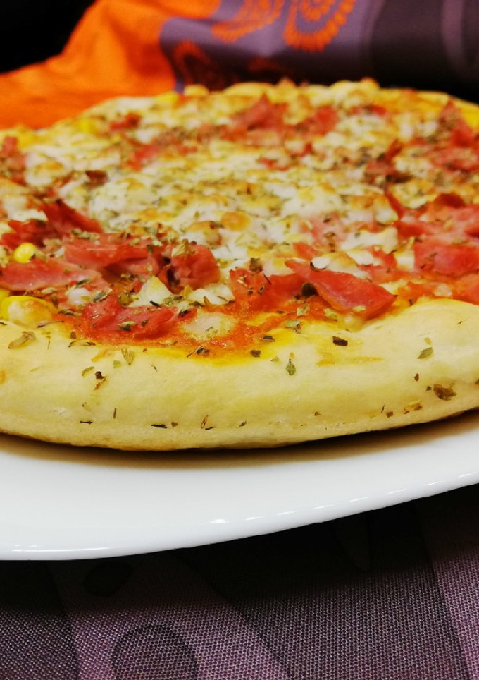 Una foto de Masa de pizza con robot Mambo