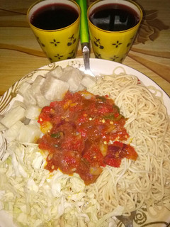 A picture of Spaghetti with yam and stew.....garnished with cabbage.