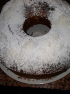 Una foto de Torta de coco beteada con chocolate