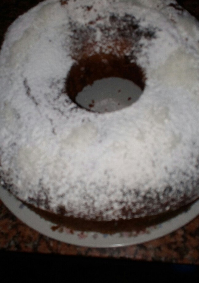 Una foto de Torta de coco beteada con chocolate
