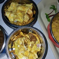 A picture of Fried potatoes chips with egg.