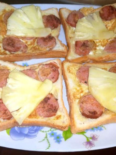 A picture of French toast with sausages.