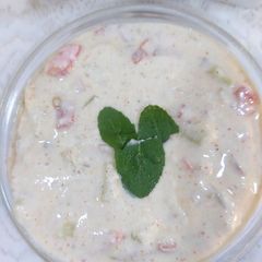 A picture of Cucumber tomato onion raita.