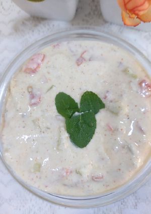 A picture of Cucumber tomato onion raita.
