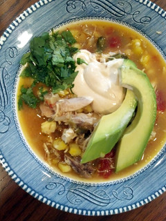 A picture of slow cooker chicken and poblano posole.