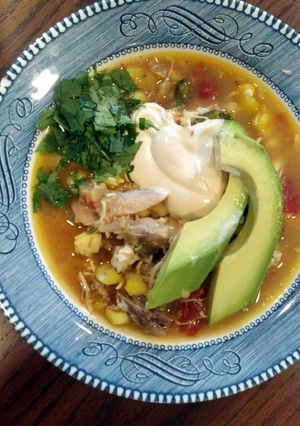 A picture of slow cooker chicken and poblano posole.