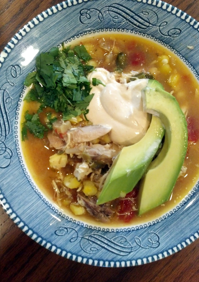 A picture of slow cooker chicken and poblano posole.
