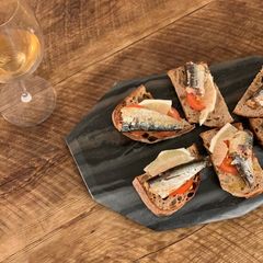 Sardine, butter, lemon, tomato & pepper on toast A picture of Sardine, butter, lemon, tomato & pepper on toast.