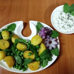 A picture of Peas potatoes, mint salad with creamy yoghurt dip.