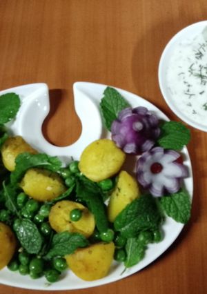 A picture of Peas potatoes, mint salad with creamy yoghurt dip.