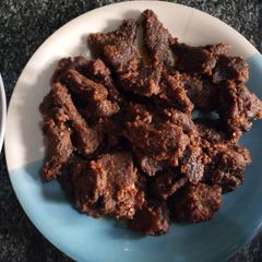 A picture of Baked beef with frying pan.
