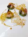 Zucchine saltate, mazzancolle flambe', tartufo, corallo d'olio