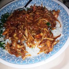 A picture of Basmati rice with cabbage sauce.