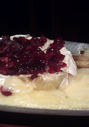 A picture of Baked Brie With Bourbon Cranberry Sauce.