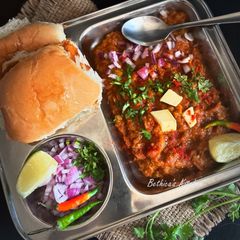 A picture of Pav Bhaji (Mixed Veggies with Toasted Bread - Mumbai Street Food).