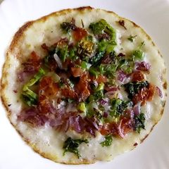 A picture of Multi colored uthappam.