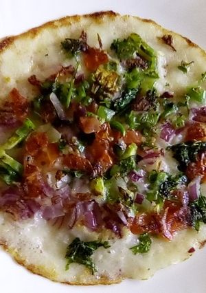 A picture of Multi colored uthappam.