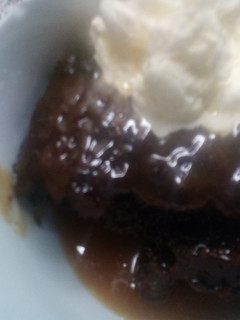 A picture of Sticky Toffee Pudding with Toffee Sauce.