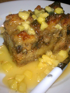 A picture of bread pudding with caramel Apple sauce.