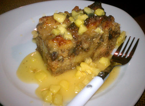 A picture of bread pudding with caramel Apple sauce.