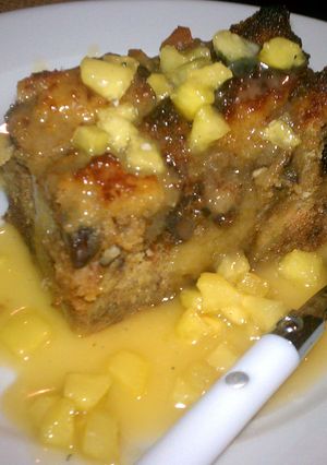 A picture of bread pudding with caramel Apple sauce.