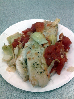 A picture of Tilapia with tomatoes.