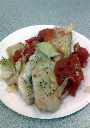 A picture of Tilapia with tomatoes.